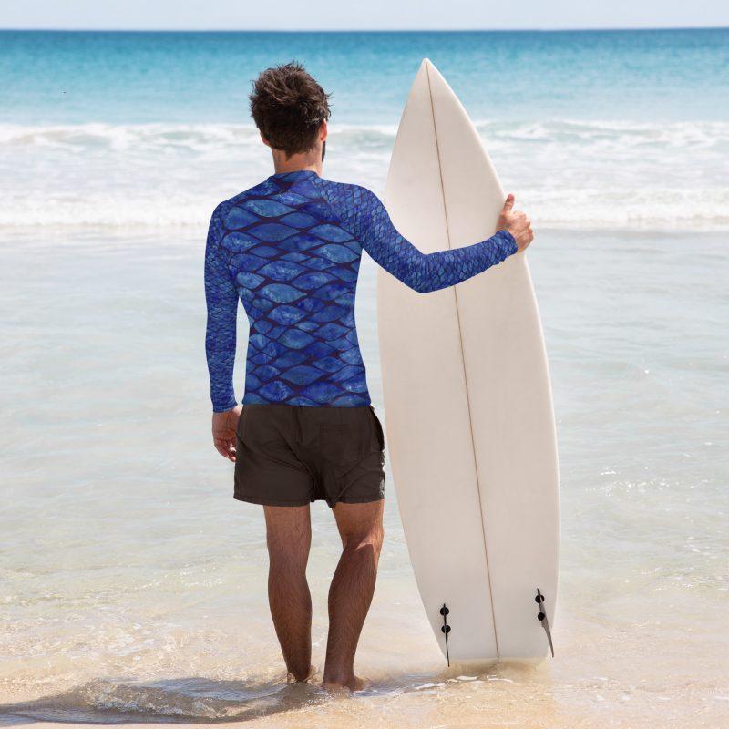 Man with surf board wearing Rashguard Tile, long-sleeve swim shirt from Mantaraj.