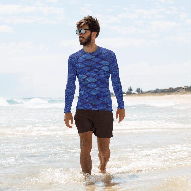 Man walking in water wearing Rashguard Tile, long-sleeve swim shirt from Mantaraj.